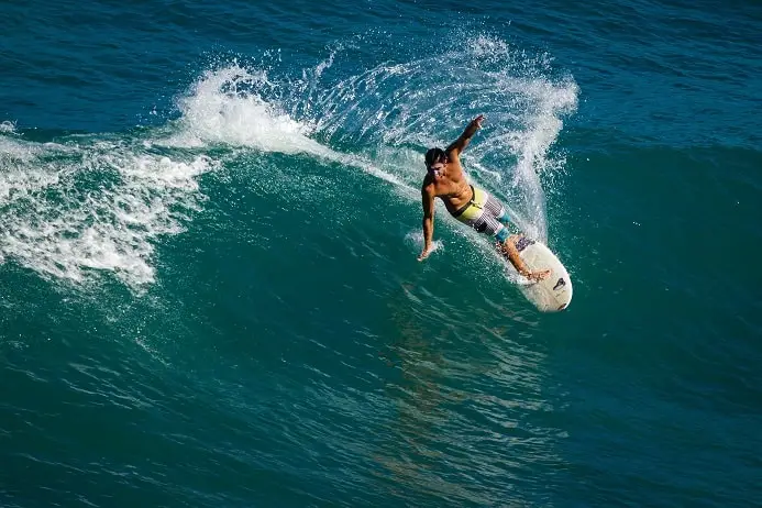 surfer performing a cut back on a wave