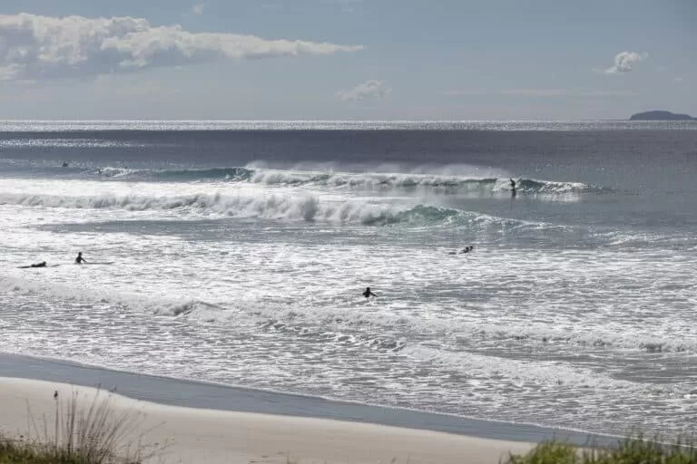 Surfers in Te Arai